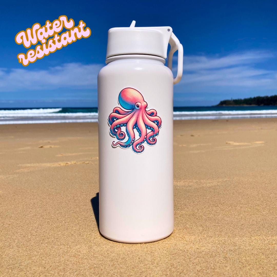 A white water bottle with a colorful octopus sticker in pink and blue hues is placed on a sandy beach. The background shows the ocean and a clear sky. The words "Water resistant" in orange text are in the top left corner, highlighting durability.