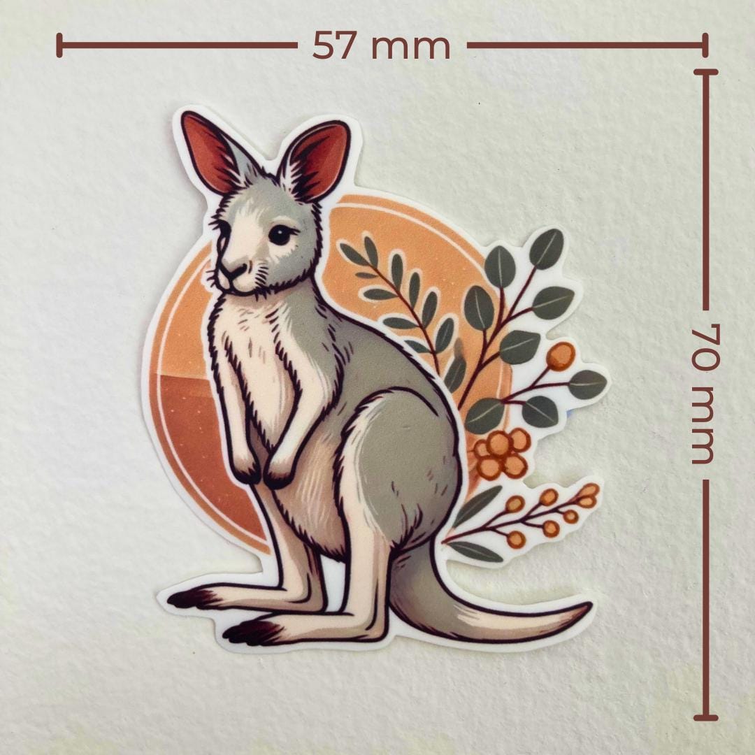 A sticker of a kangaroo with a tan circle and leafy branches is shown against a white background. Brown measurement lines indicate the sticker’s dimensions: 57 mm wide and 70 mm tall. The kangaroo has white fur with soft shading and upright ears
