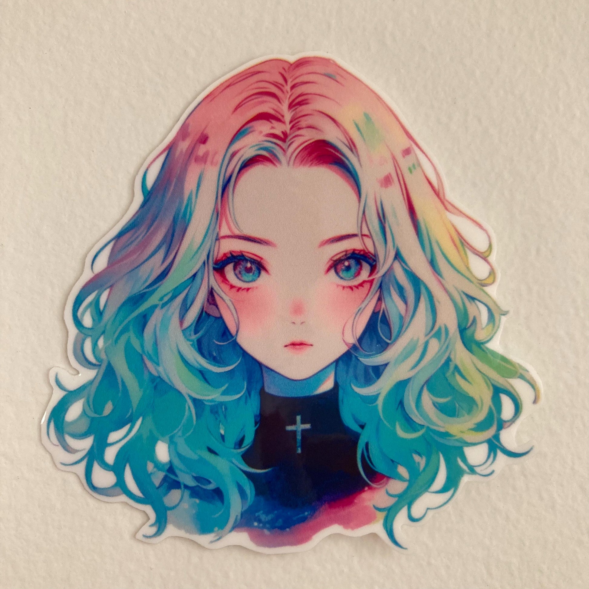 Sticker of an anime girl with rainbow-colored hair and bright blue eyes, wearing a black top with a cross, set against a plain light background.
