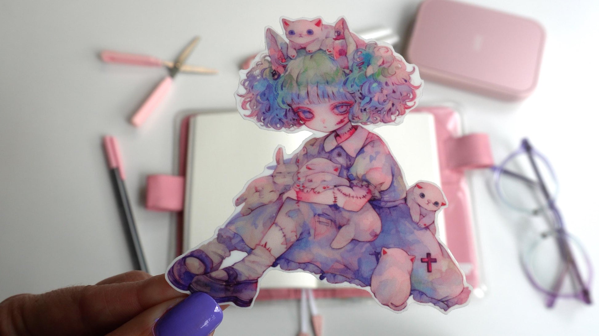 Sticker of an anime-style character with pastel curly hair sitting with several small white animals, including cats and bunnies. The character wears a blue dress with stitched arms and legs, holding a stuffed animal