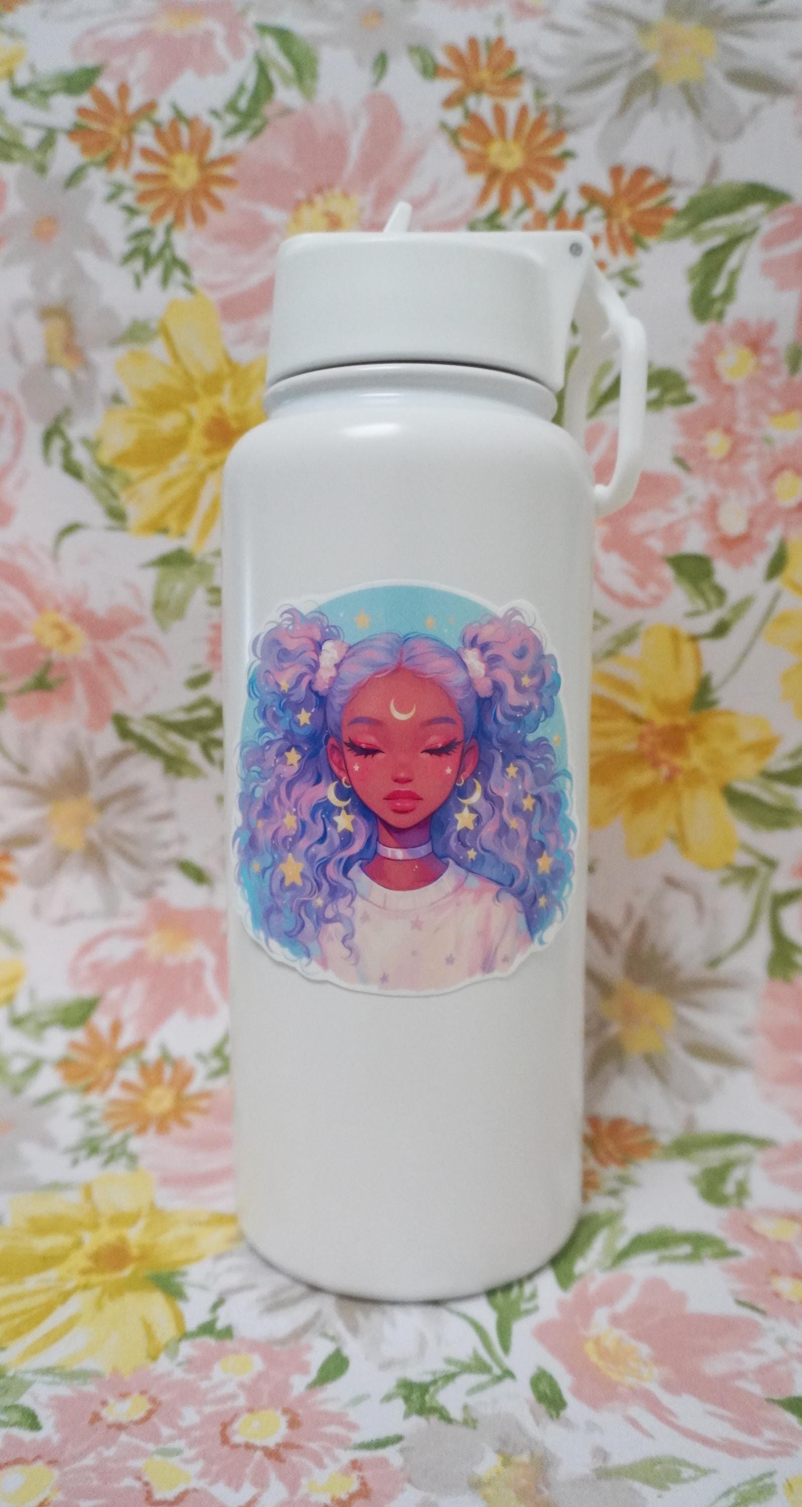 A white water bottle with an anime-style sticker of a girl with lavender and blue curly hair, eyes closed, and a crescent moon on her forehead, set against a floral-patterned background.