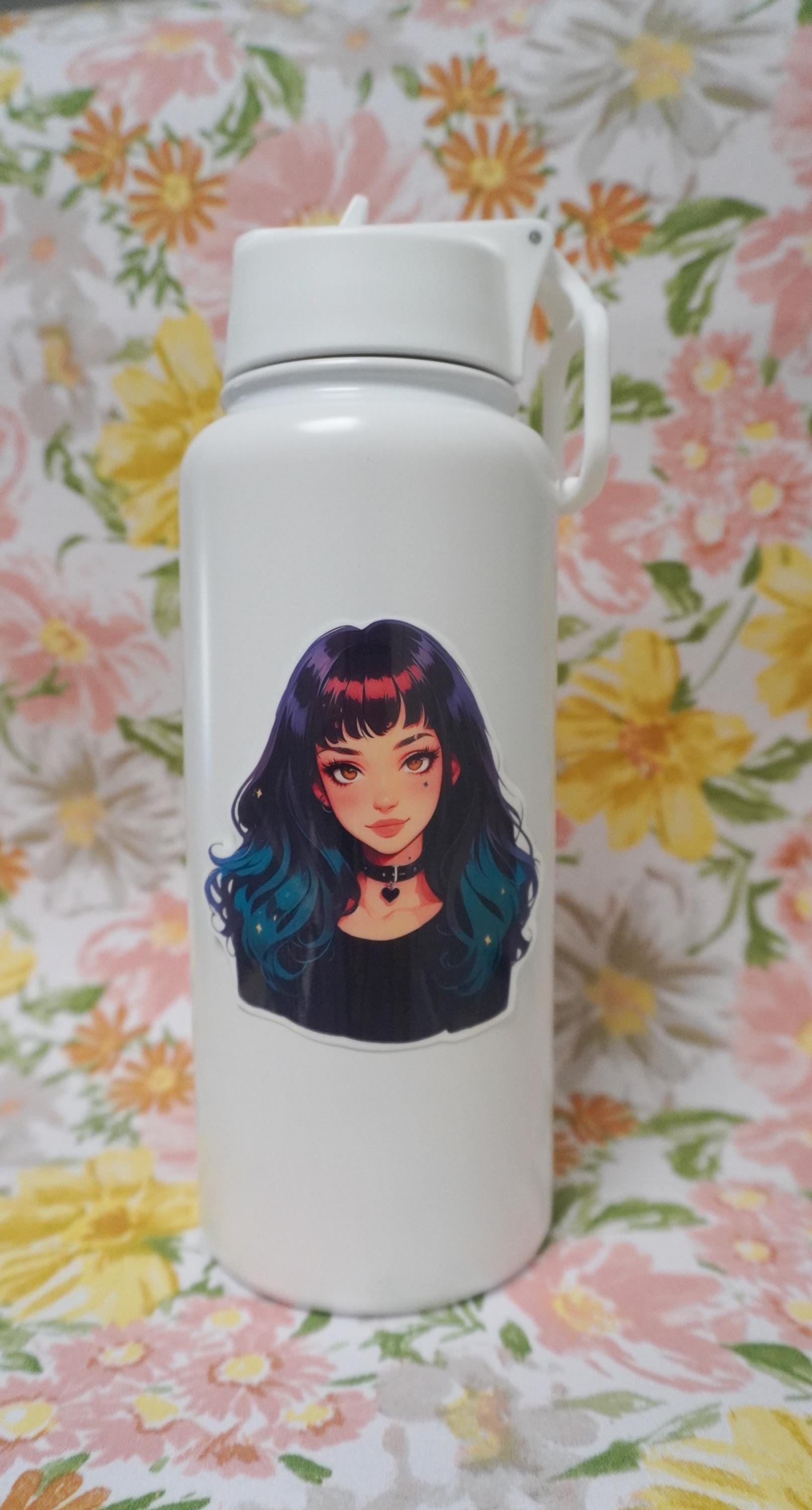 A white water bottle with a sticker of an anime-style character with long black-to-teal gradient hair and a heart choker, set against a floral-patterned background.