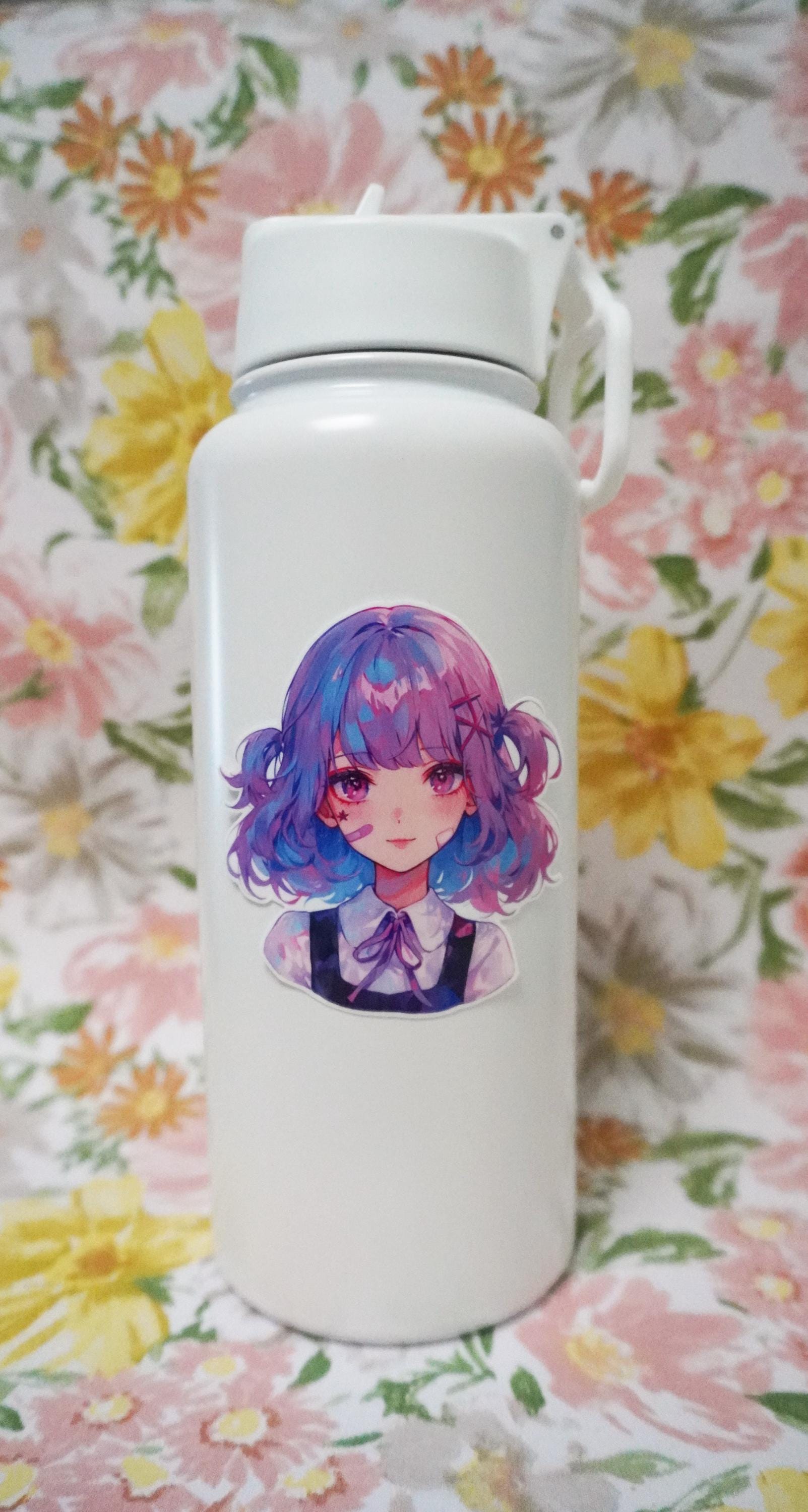 A white bottle with a sticker of an illustrated girl with short wavy hair in blue and pink tones, wearing a collared blouse with a bow. The background is a floral pattern with large yellow, pink, and green flowers.