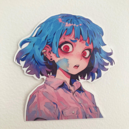 A close-up of a sticker featuring an anime character with blue hair, red eyes, and a surprised expression, wearing a pink shirt. The sticker is placed on a plain, light-colored background.